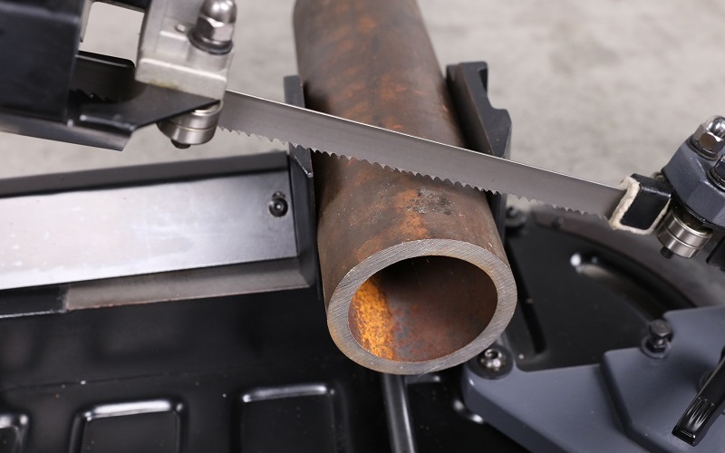 Band saw cutting steel pipe